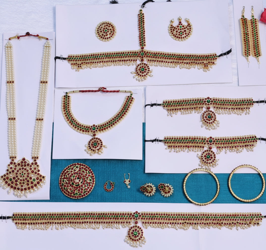 A beautifully arranged full dance set of traditional Indian classical jewelry, featuring intricate craftsmanship typical of temple dance jewelry