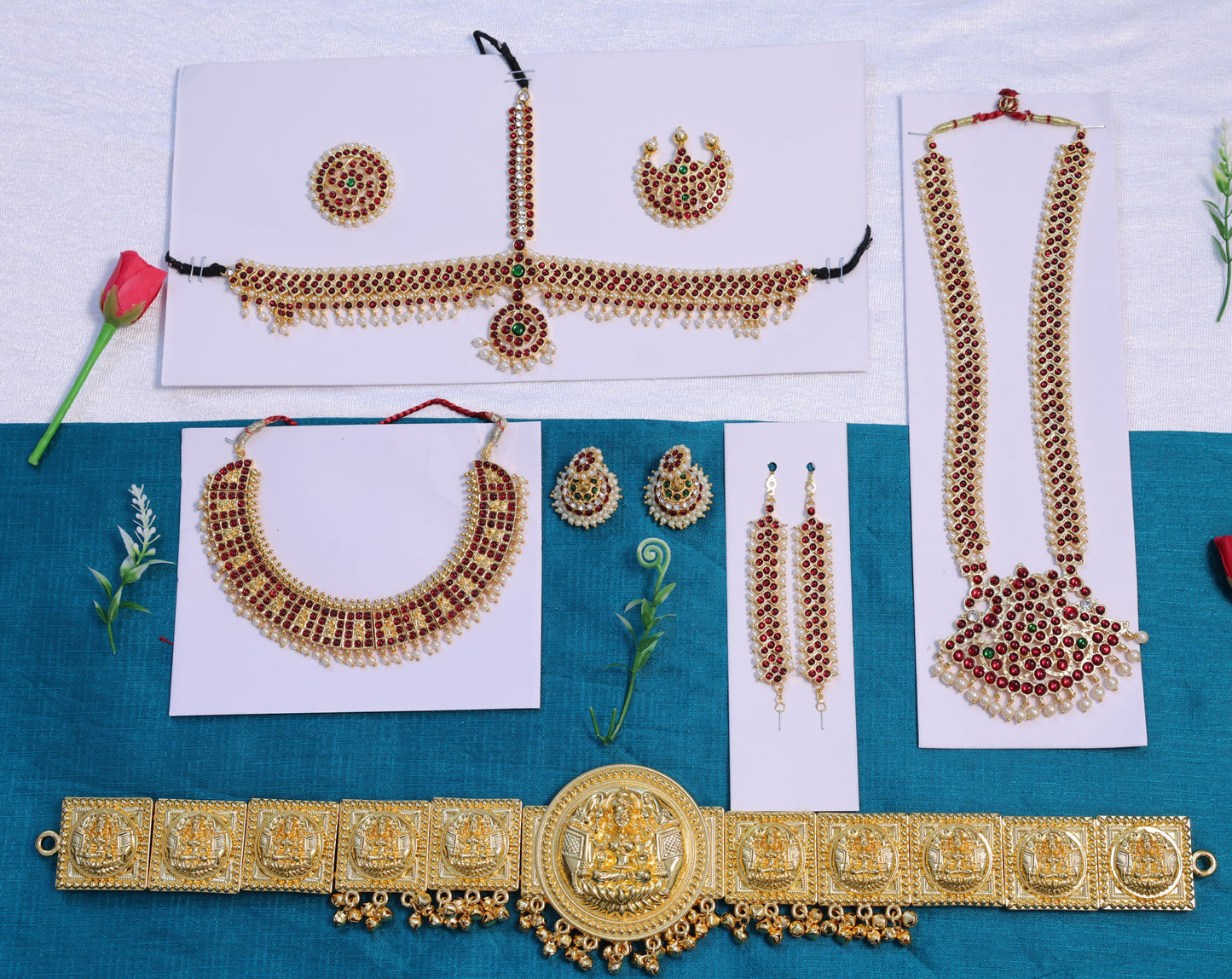 Temple jewellery set for classical dance featuring dance long haram, short necklace, Bharatanatyam headpiece, jhumkas and gold oddiyanam belt with Kemp stones