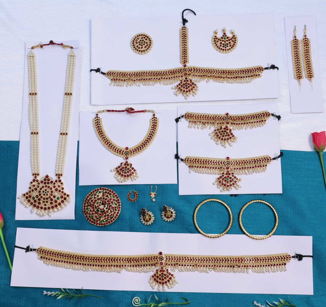 Kemp stone jewelry dance accessories set, including necklace, earrings, and hair ornaments, designed for classical Indian dance performances. Features traditional red and green stones with gold-toned detailing. Suitable for Bharatanatyam or other classical dances. Available for worldwide shipping, including India.