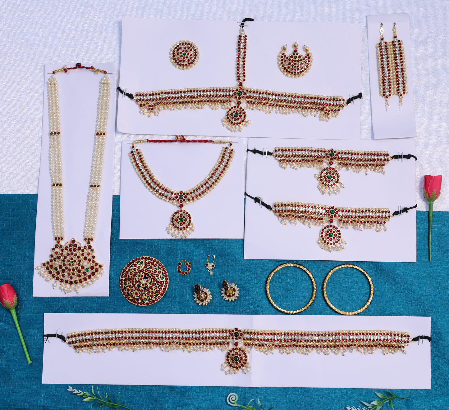 Traditional South Indian Bharatanatyam dance jewellery full set in mango pattern with red and green kemp stones and micro gold plating.