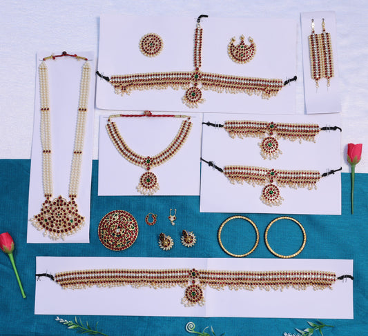 Traditional South Indian Bharatanatyam dance jewellery full set in mango pattern with red and green kemp stones and micro gold plating.