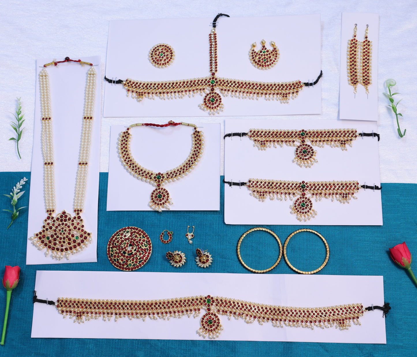 Traditional South Indian Kemp stone jewelry set for dance performances, including necklace, earrings, and hair accessories for Bharatanatyam and Kuchipudi.