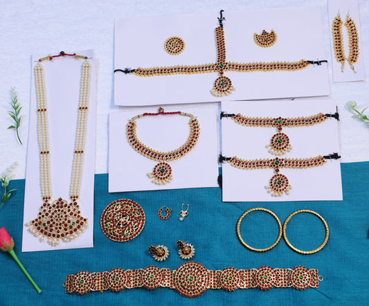 Kemp stone jewelry set for Bharatanatyam and Kuchipudi, including necklace, earrings, and hair accessories with traditional red and green stones.