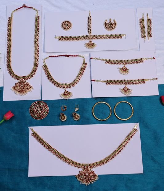 Traditional Bharatanatyam temple jewellery set with red and green stones