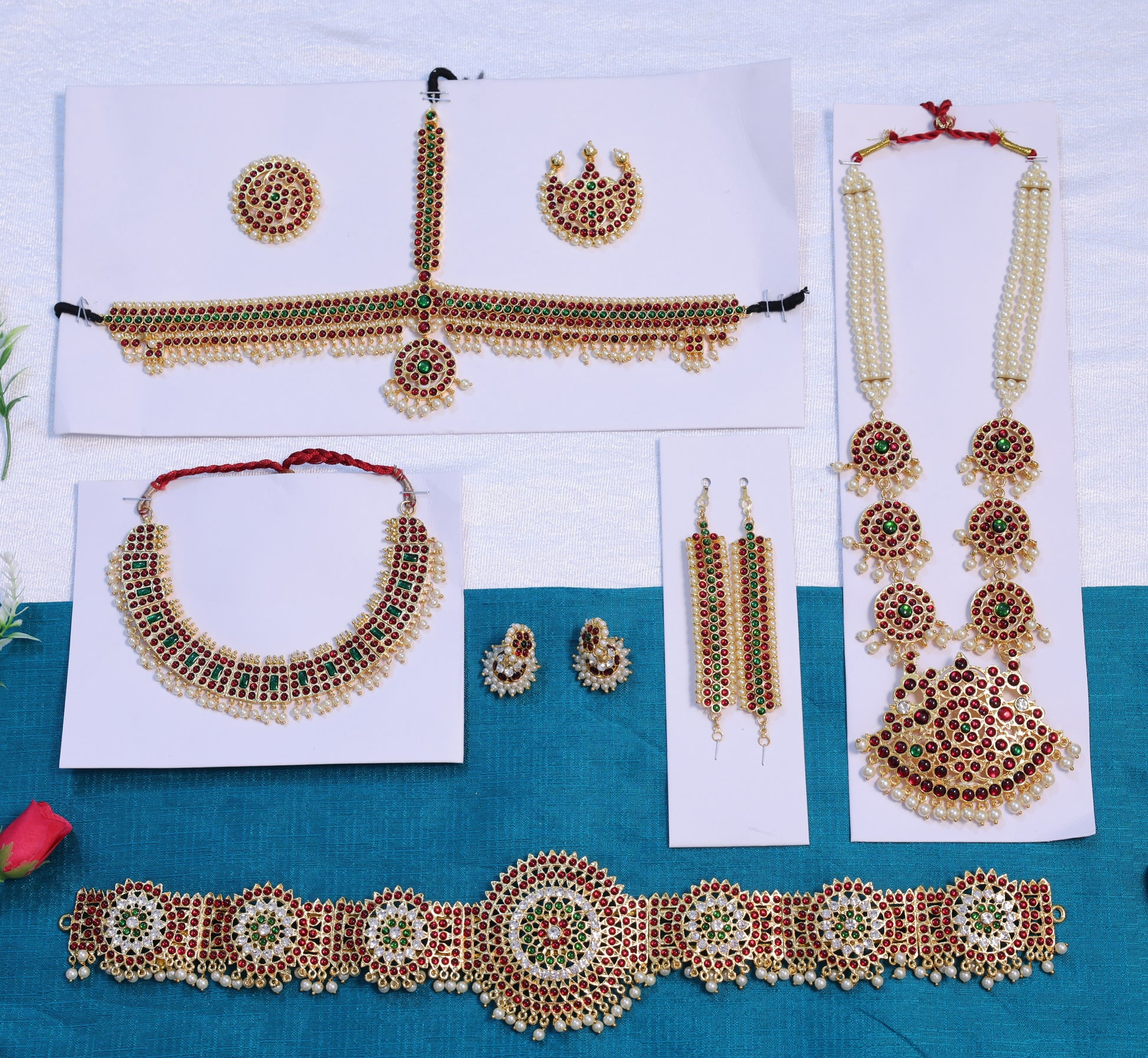 Premium Bharatanatyam and Kuchipudi temple jewelry set with haram, choker, oddiyanam, jhumkas and headpieces crafted with Kemp stones, available for fast USA shipping.