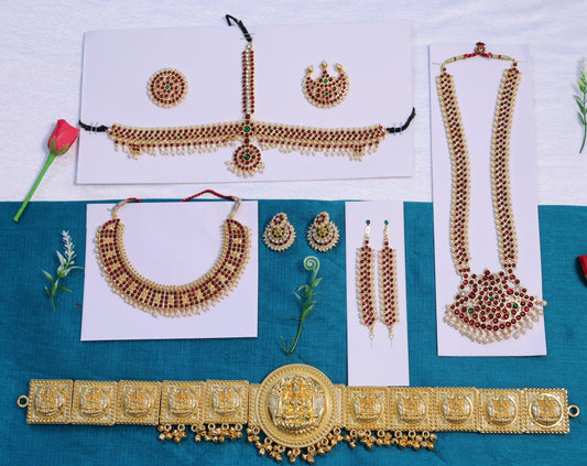 Temple jewellery set for classical dance featuring dance long haram, short necklace, Bharatanatyam headpiece, jhumkas and gold oddiyanam belt with Kemp stones
