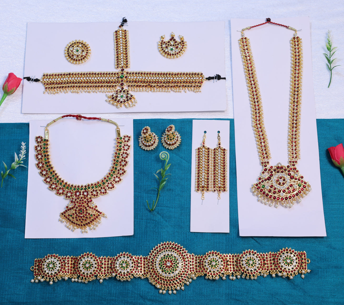 Full Bharatanatyam and Kuchipudi temple jewellery set with long haram, choker, jhumkas, vanki, oddiyanam, and headset in red-green Kemp stones and gold finish.