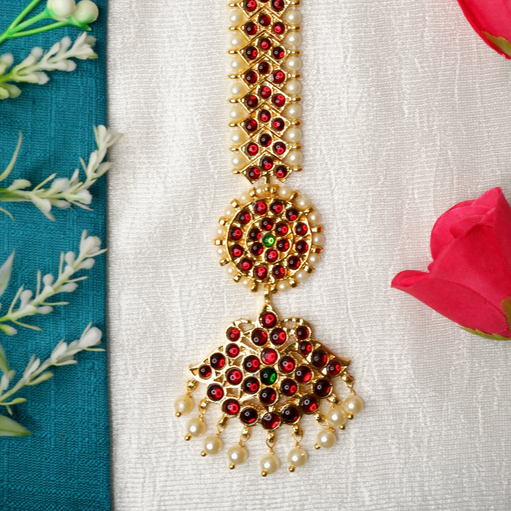 Detailed view of Bharatanatyam mang tika, a forehead ornament used in Indian classical dance.