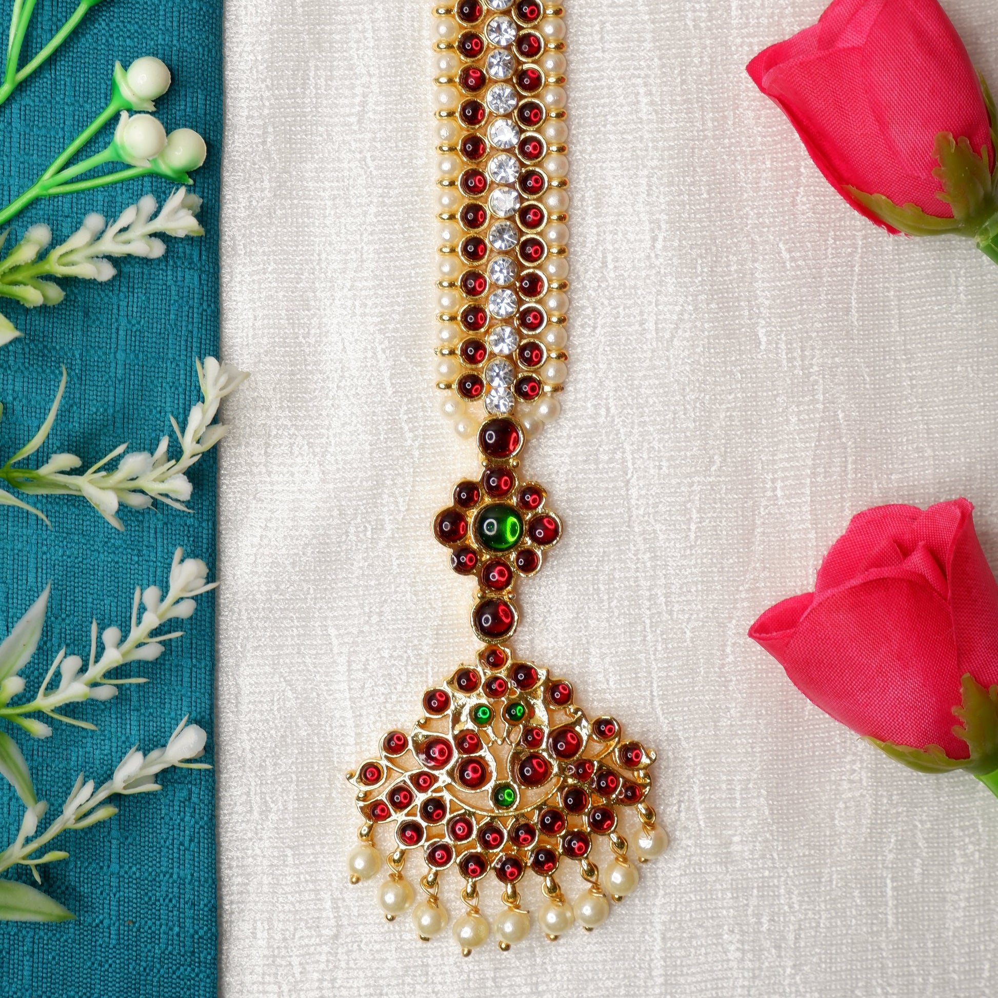 Close-up of papidi billa headpiece in Bharatanatyam dance makeup and costume