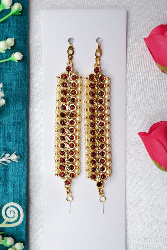 Traditional mattal arm bands for Bharatanatyam and Kuchipudi classical dance with kempu stones, pearls, and green accent stones in gold-toned temple jewelry design
