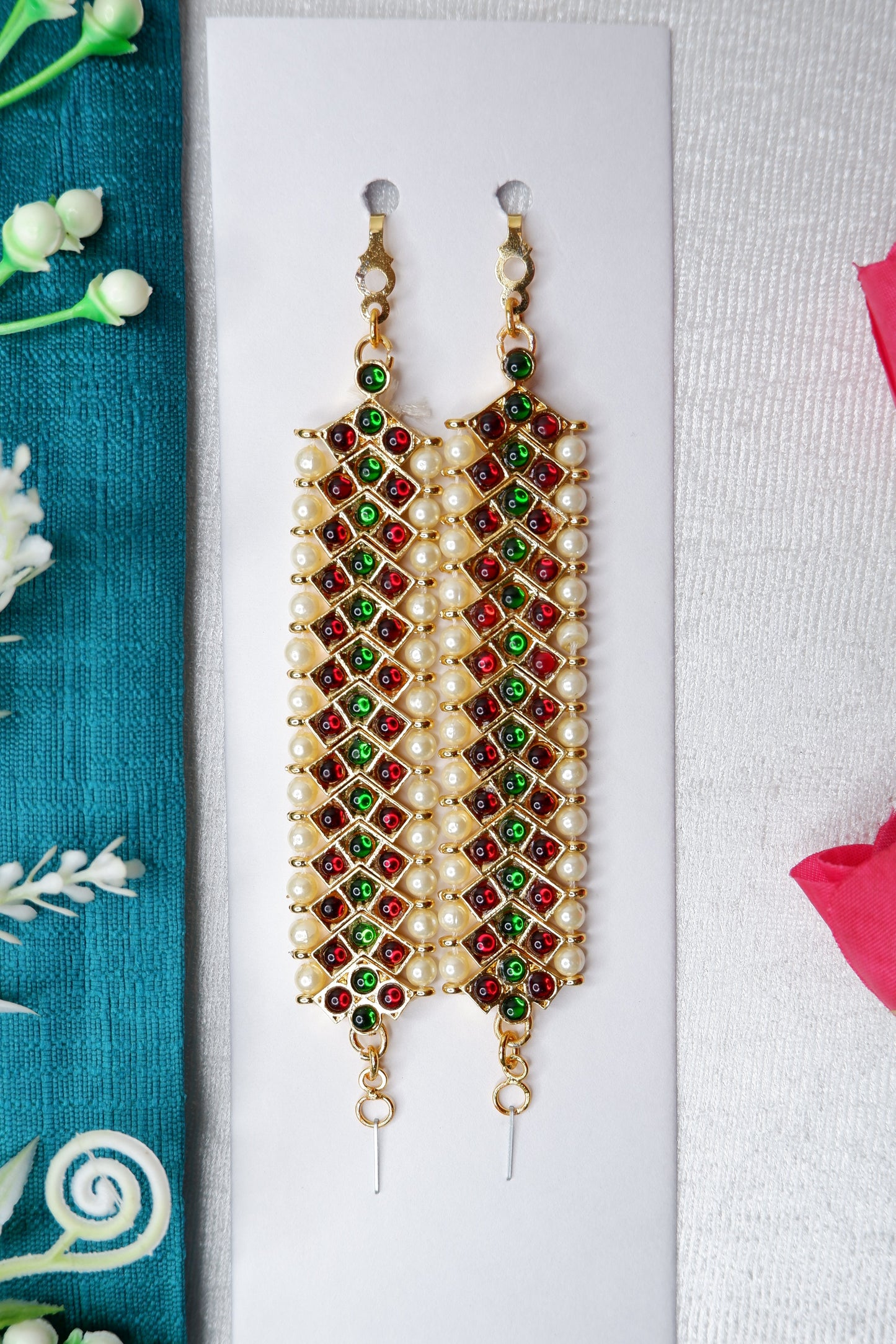 Mattal performing Kuchipudi dance in vibrant traditional attire on stage