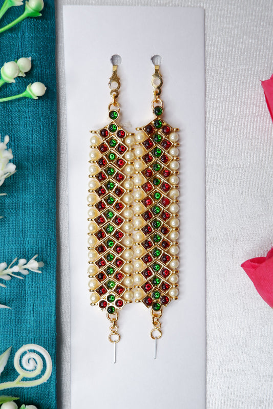 Mattal performing Kuchipudi dance in vibrant traditional attire on stage