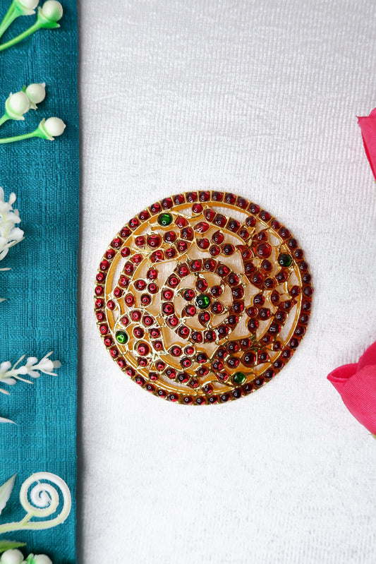A dancer wearing a traditional rakodi hair ornament as part of Bharatanatyam/Kuchipudi attire.