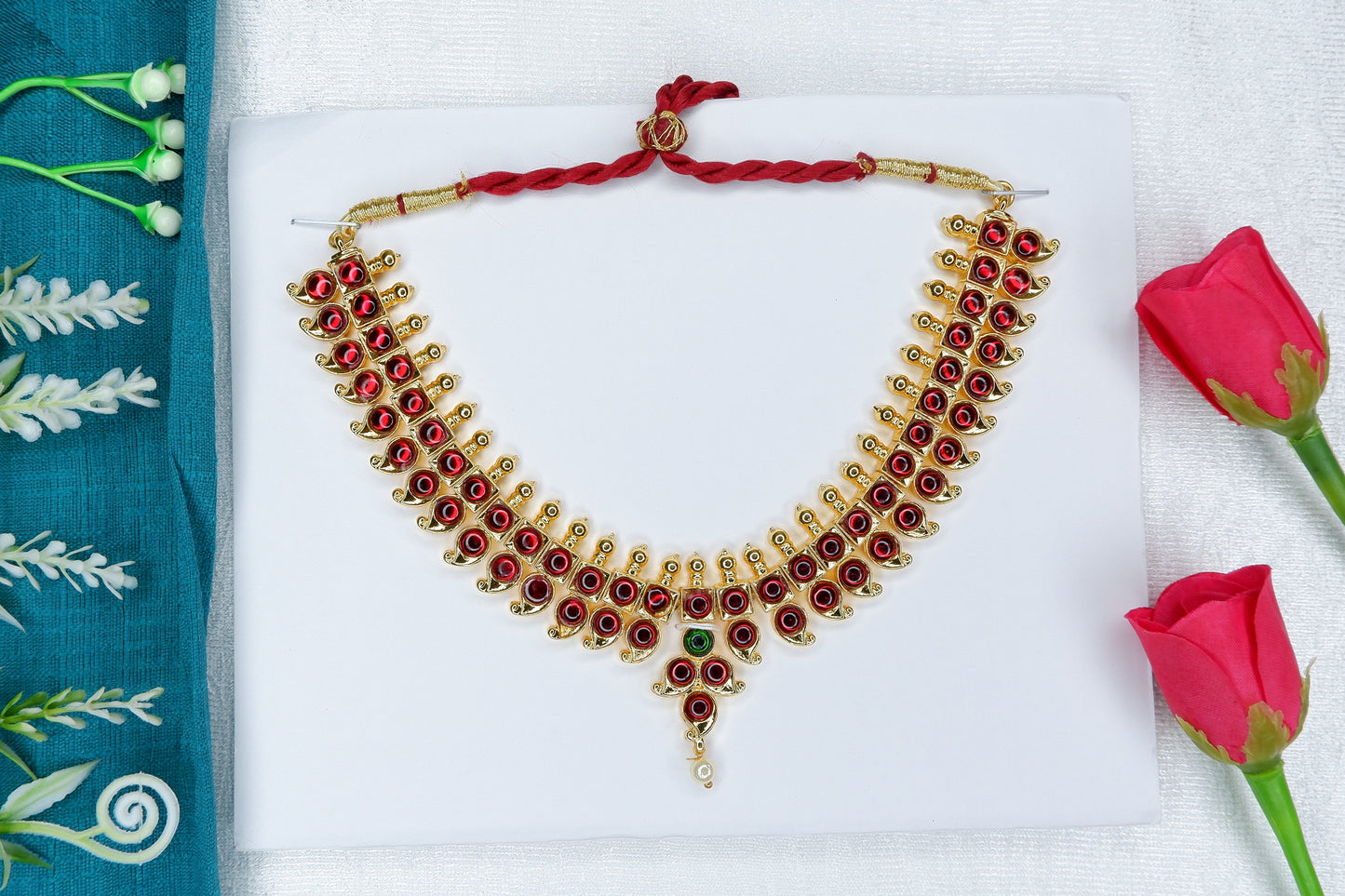 Traditional Kuchipudi short dance necklace with temple jewelry detailing and red-green stones.
