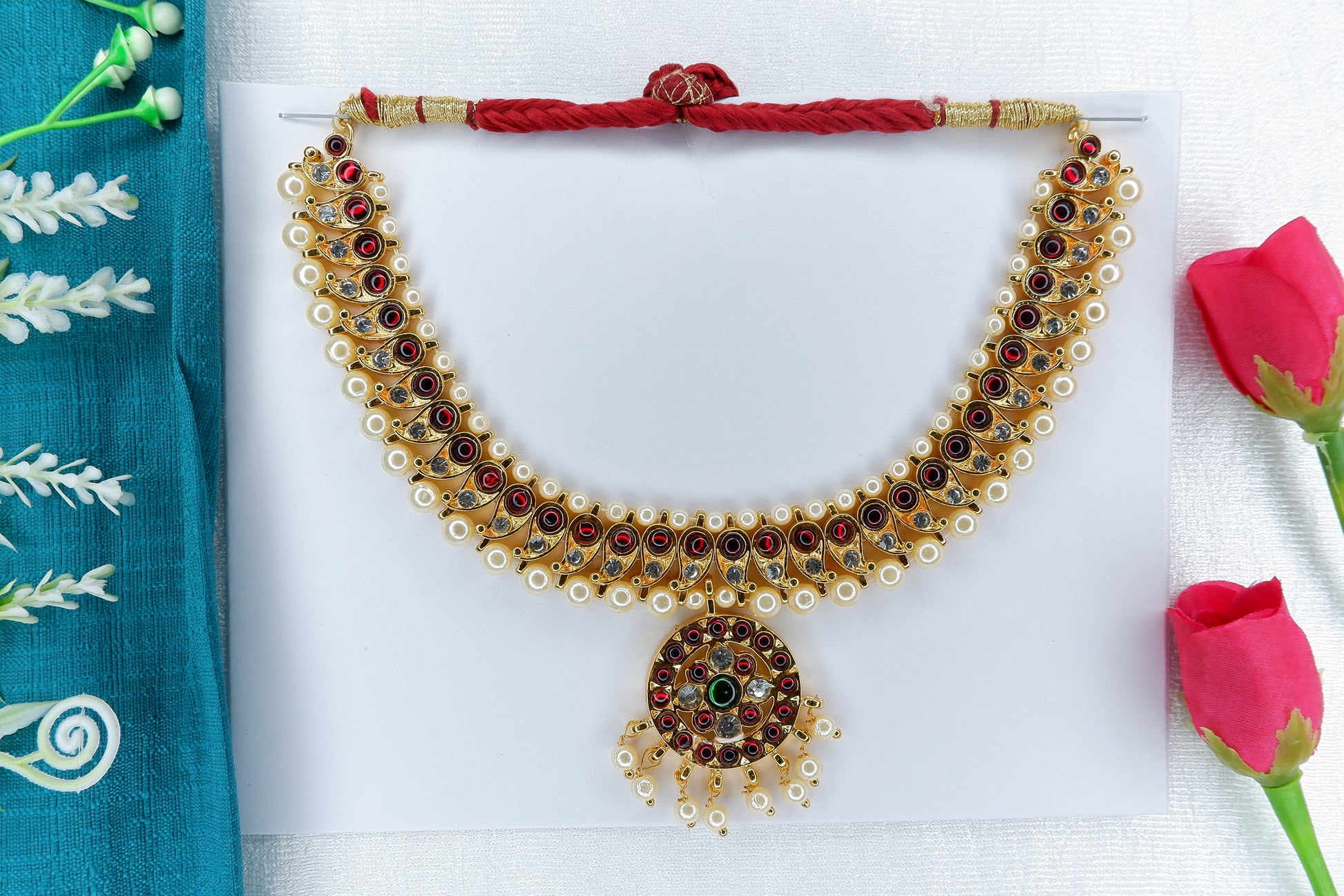 gold-toned temple jewellery short necklace with traditional motifs for classical dance