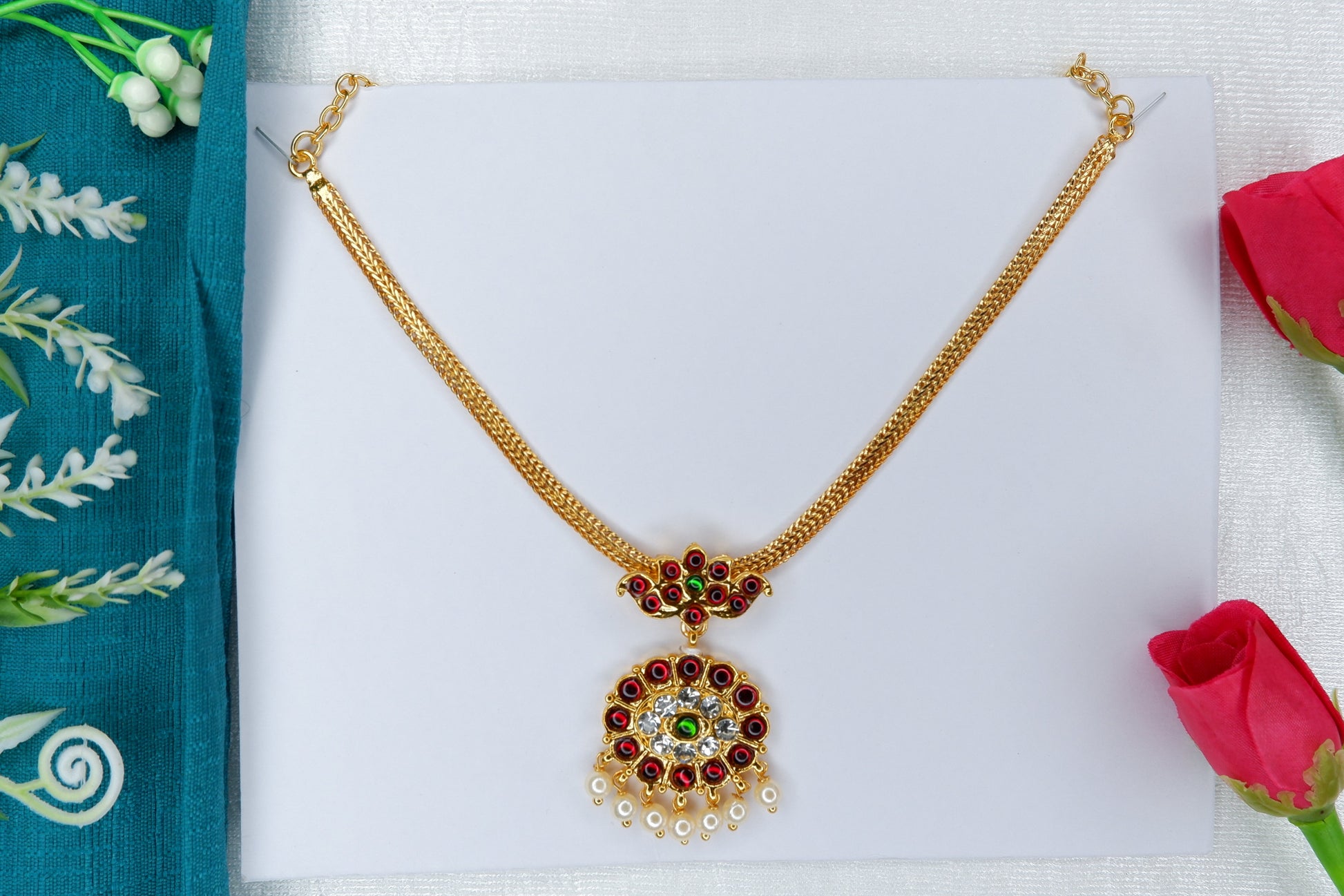 Short gold-toned temple jewelry necklace adorned with intricate motifs, worn for Bharatanatyam and Kuchipudi classical dance performances